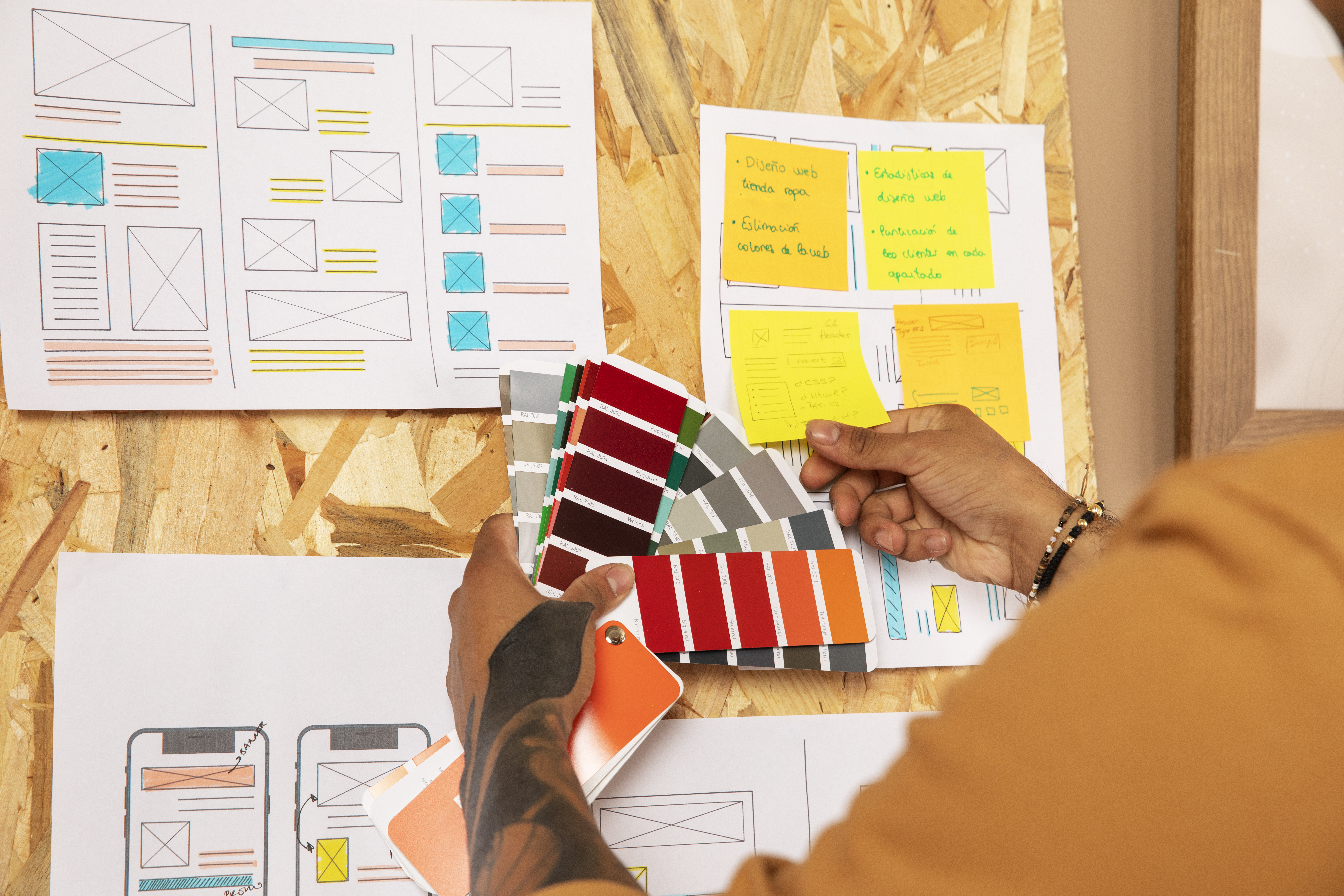 side view designer holding color palette